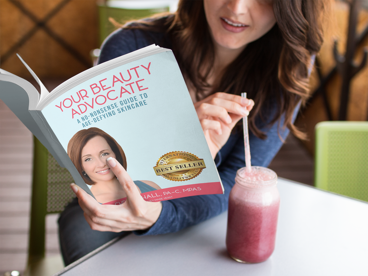 Relaxed Woman in Cafe Reading Your Beauty Advocate Book by Christy Hall | Shop Mikel Kristi Skincare