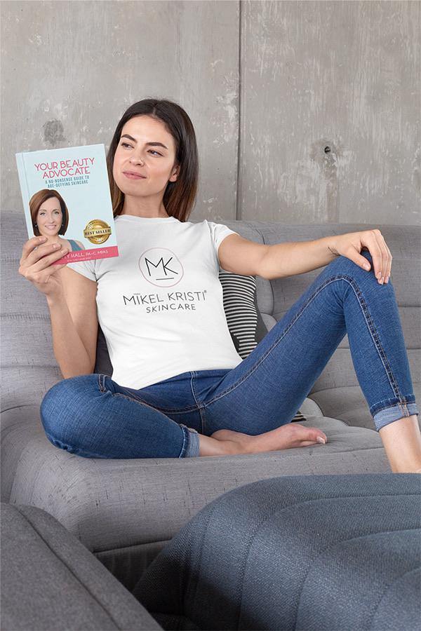 Relaxed Girl Reading Your Beauty Advocate Book by Christy Hall | Shop Mikel Kristi Skincare